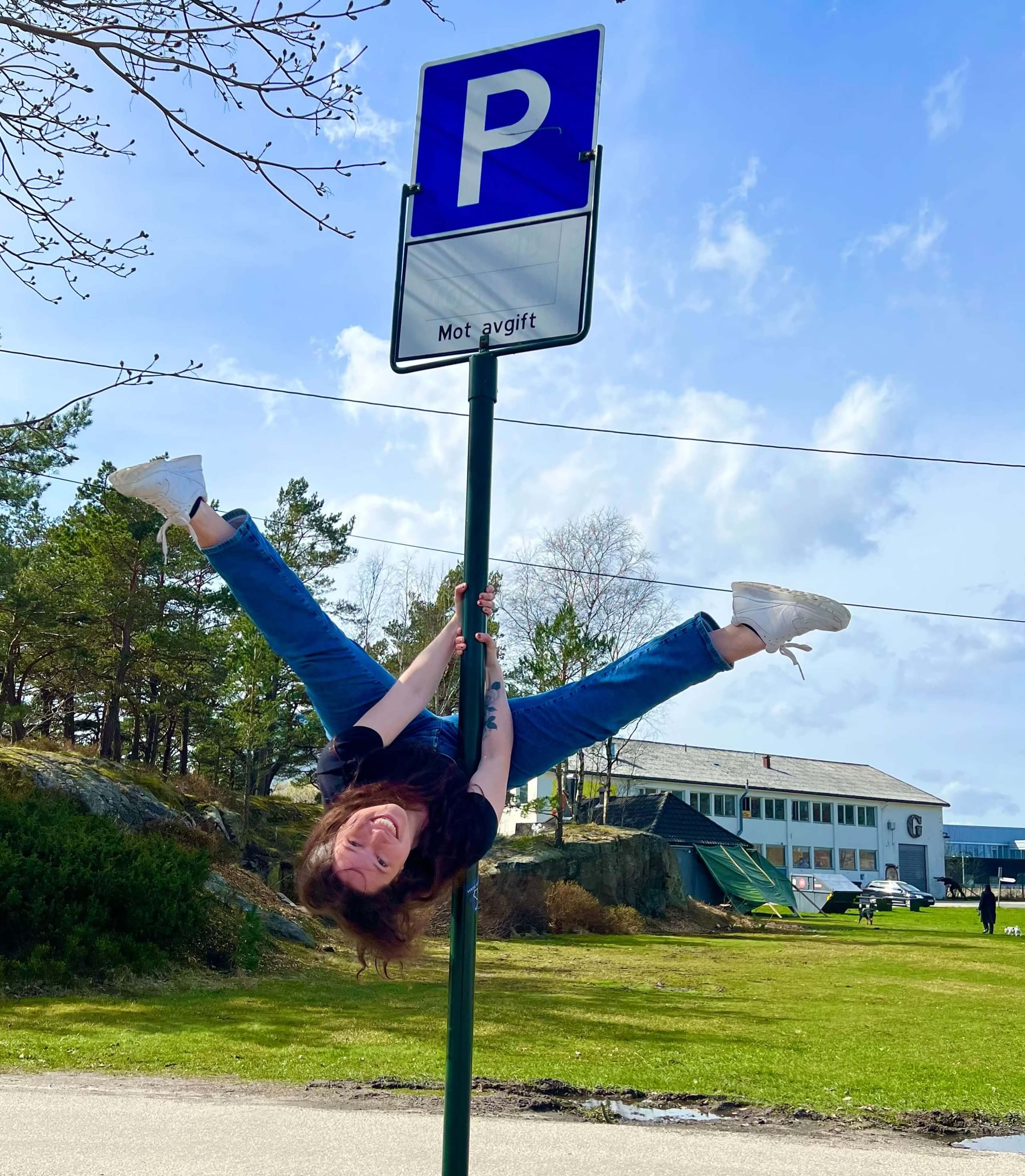 Me hanging upside-down on a pole